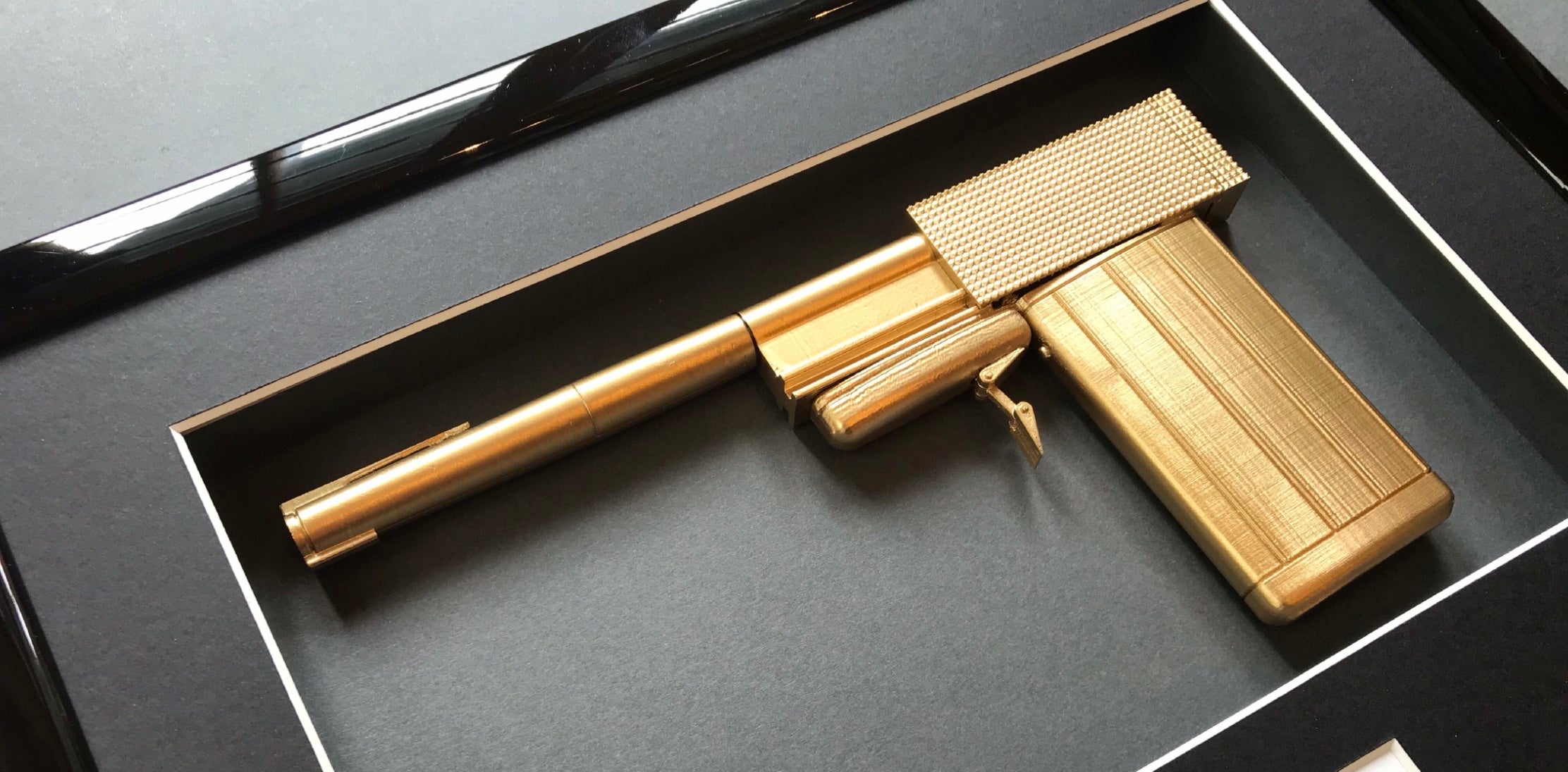 The Man With The Golden Gun (1974) - A Limited Edition Replica Movie Prop Golden Gun & Autograph Display
