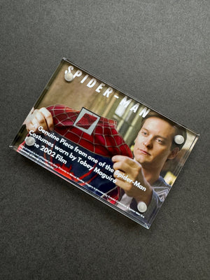 A Miniature Movie Prop Display featuring a genuine piece of Tobey Maguire Costume 