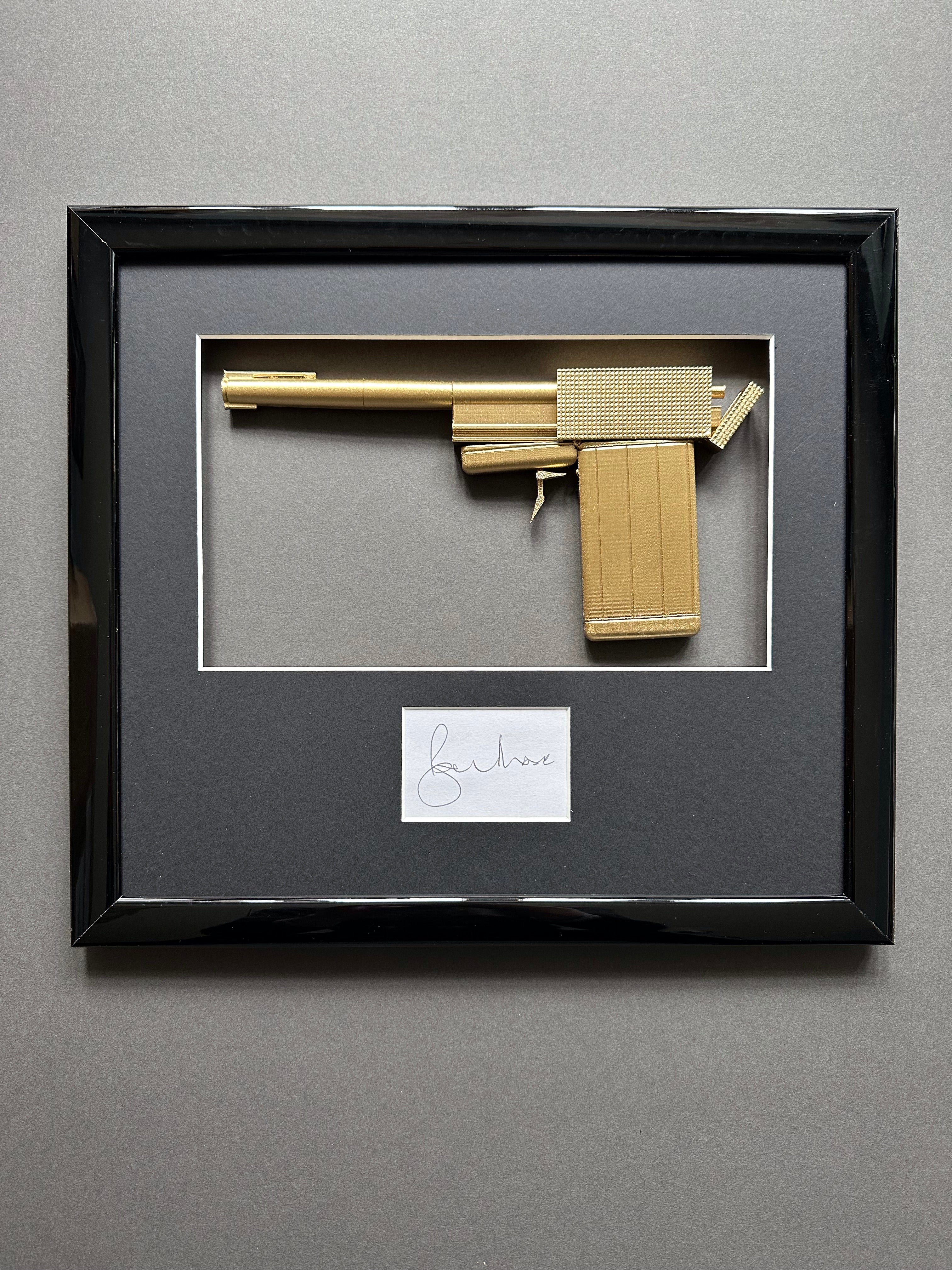 The Man With The Golden Gun (1974) - A Replica Golden Gun & Sir Roger Moore Autograph